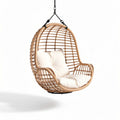 Hanging rattan egg chair with soft cushions for indoor and outdoor use